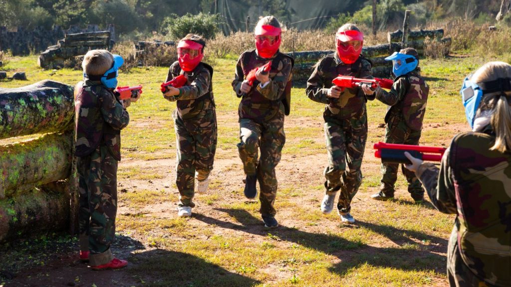 Children Playing Paintball Game