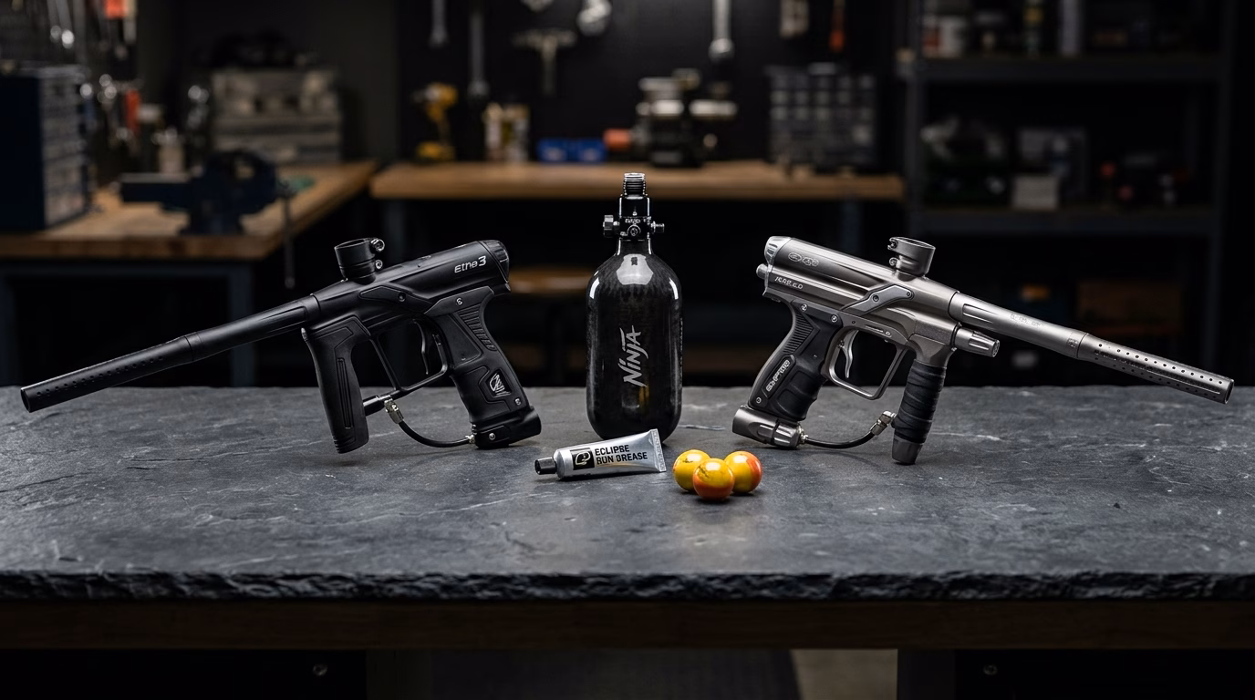 Planet Eclipse Etha 3 vs Empire Axe 2.0 electronic paintball markers side by side on armorer workbench
